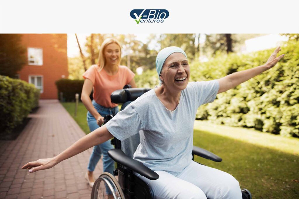 Smiling cancer patient woman in wheelchair