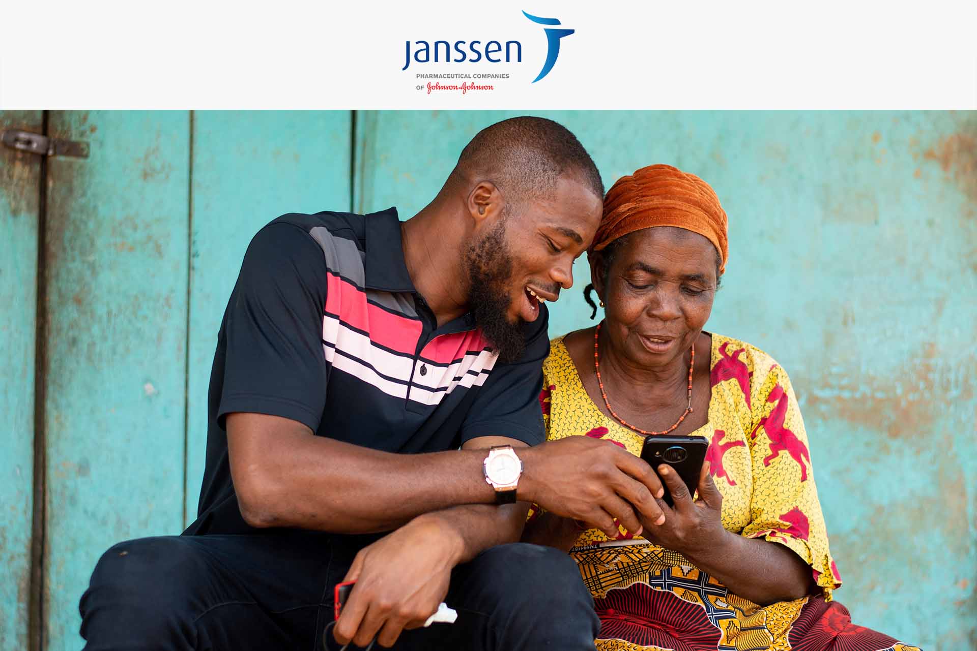 African man and woman looking at a phone