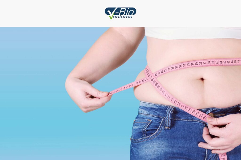 Overweight person's torso with measuring tape