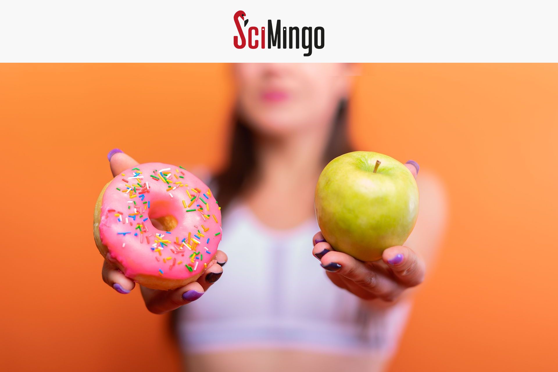 Woman holding a donut and an apple